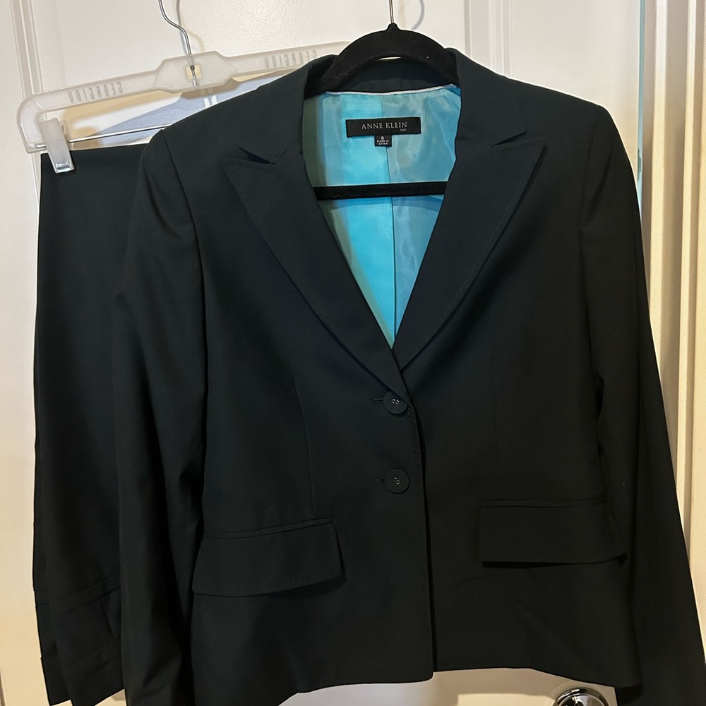 Dark Green suit. Never worn. Very nice.